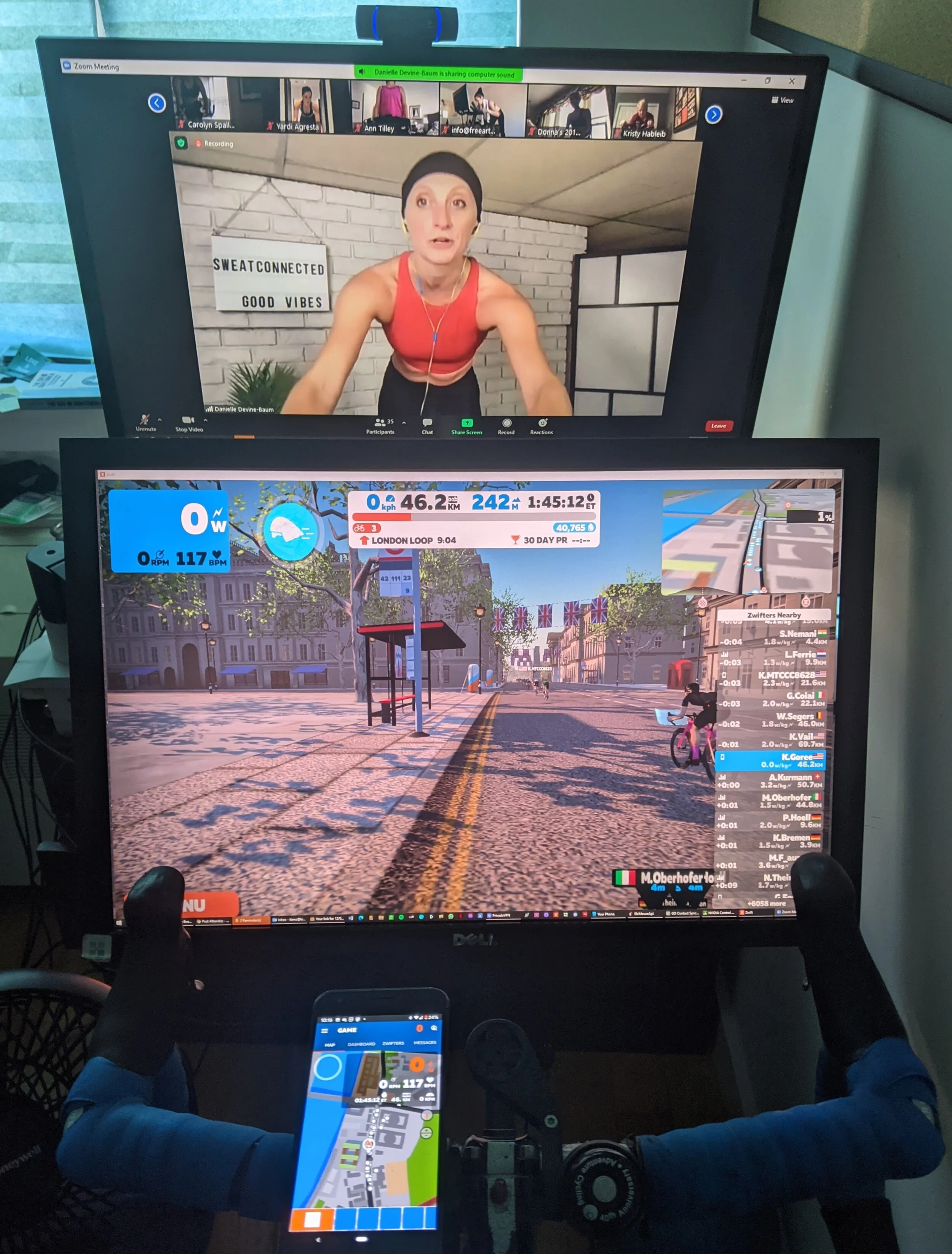  Multi-tasking with a Zoom workout on @sweat.connect with @ddb_fitness wile Zwifting on the main screen and the Zwift Companion app on the bars 